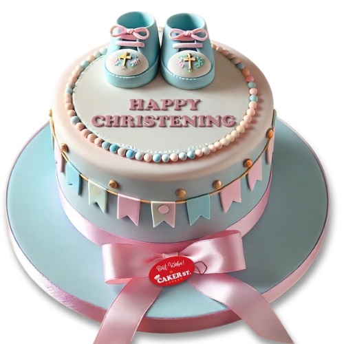 Round Christening cake with blue baby booties, pastel bunting, and pink ribbon.