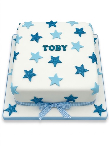 Square white cake with light and glittery blue stars, blue gingham ribbon, and personalised name.