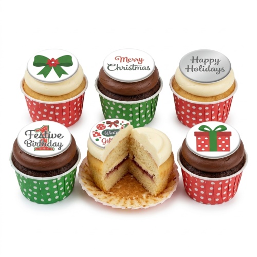 A selection of Christmas and festive cupcakes with various holiday-themed edible toppers and polka dot wrappers.