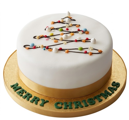 Round white Christmas cake with a black Christmas tree outline, colourful sprinkles, and 'Merry Christmas' text.