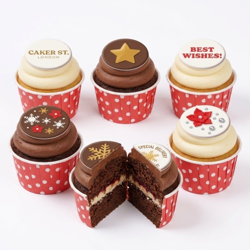 Assortment of Christmas themed cupcakes with snowflakes, stars, and poinsettia decorations.