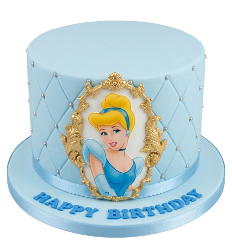 Light blue Cinderella birthday cake with gold ornate frame and silver pearls.