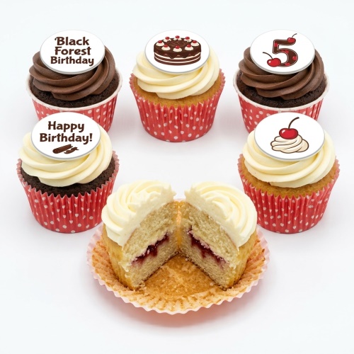 Selection of Black Forest themed birthday cupcakes with chocolate and vanilla frosting, edible toppers including a custom age number.