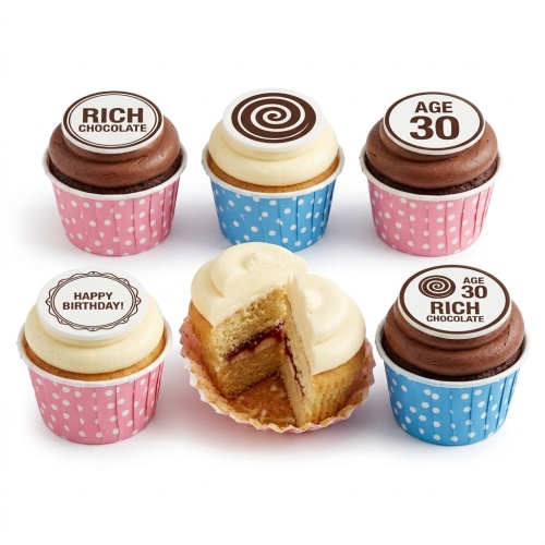 Assorted birthday cupcakes with custom age and "Happy Birthday" toppers, in pink and blue polka dot wrappers.