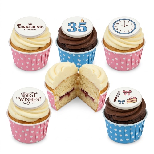 Assortment of birthday cupcakes with white and chocolate frosting, featuring custom age and celebration toppers.