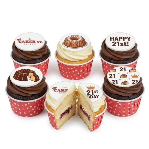 Assortment of custom age birthday cupcakes with cake and crown toppers in red polka dot cases.