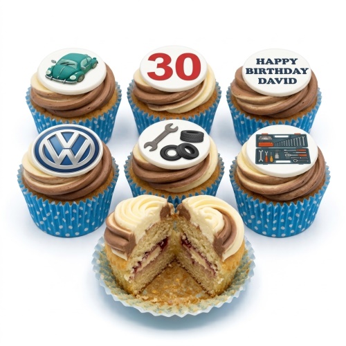 Automotive themed birthday cupcakes with classic car, VW logo, wrench, tools, and custom age toppers.