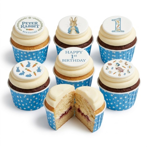 Peter Rabbit 1st birthday cupcakes with character toppers, carrot designs, and a number one.