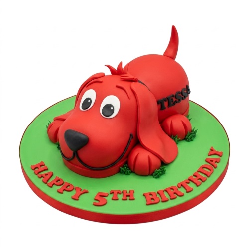 3D sculpted Clifford the Big Red Dog birthday cake on a green base with custom message.
