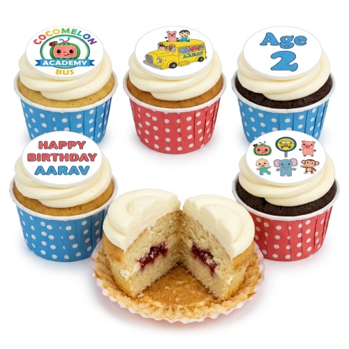 Cocomelon themed cupcakes with character toppers, bus, and logo, in red and blue polka dot cases.