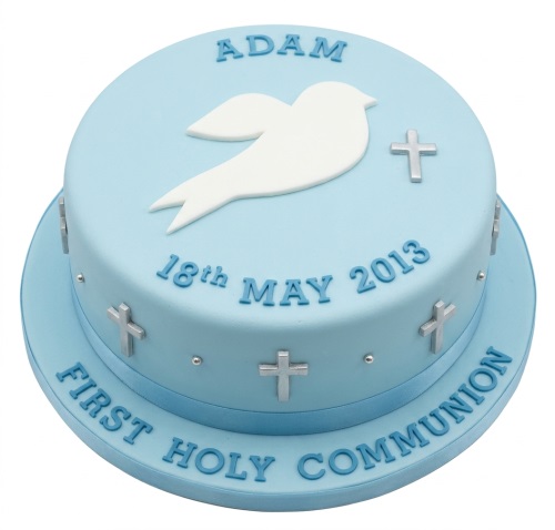 Light blue First Holy Communion cake with white dove, silver crosses, and custom name and date.