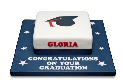 White square graduation cake with a black cap and red tassel on top, on a navy blue board with white stars and a custom message.