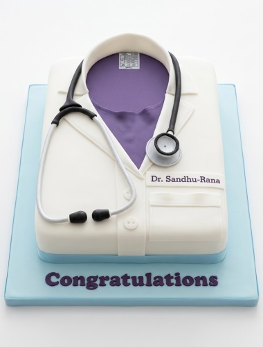 White doctor's lab coat cake with purple shirt, black stethoscope, and light blue board.