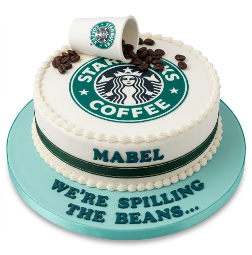 Round white cake with Starbucks logo, edible coffee cup, coffee beans, and green ribbon.