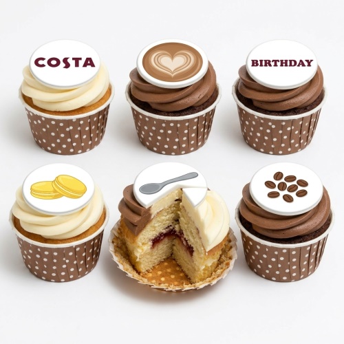 Assortment of Costa Coffee themed birthday cupcakes with latte art, coffee beans, spoon, and macarons.