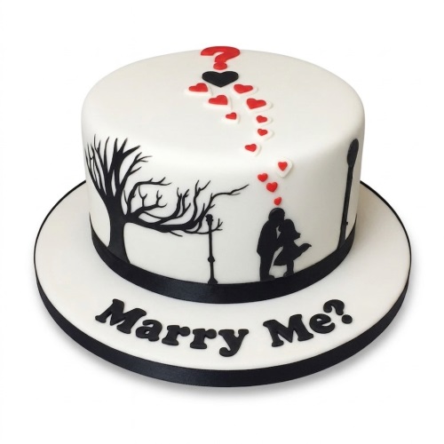 White round cake with black silhouette of a couple, trees, lampposts, red hearts, and "Marry Me?" text.