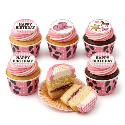 Cowgirl theme birthday cupcakes with pink and white frosting, pink cow-print wrappers, and toppers featuring a pink hat, horse, sheriff star, and butterflies.