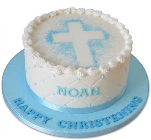 White christening cake with blue cross and personalised name for a baby boy.
