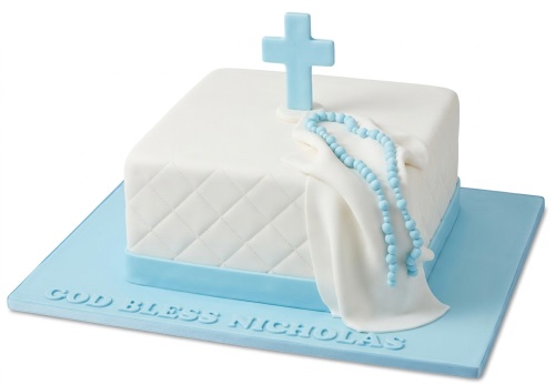 White square christening cake with blue cross, rosary beads, and quilted pattern