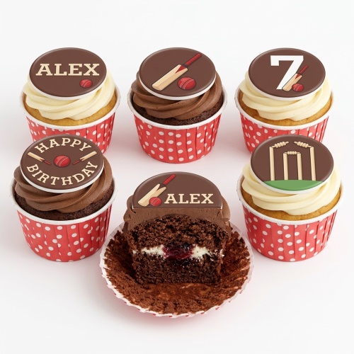 Cricket themed cupcakes with bat, ball, stumps, and custom age/name toppers in red polka dot cases.