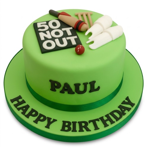 Green cricket birthday cake with bat, ball, stumps, bails, and '50 Not Out' scoreboard.