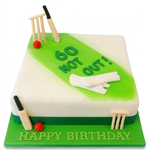 White and green rectangular cricket-themed birthday cake with edible bats, stumps, balls, and custom age "Not Out!" message.
