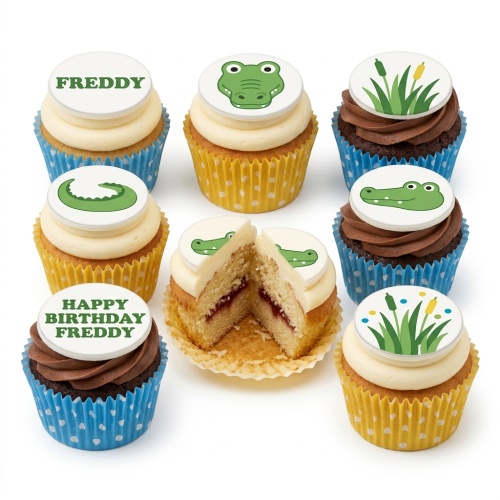 Selection of cupcakes with alligator head, alligator tail, and reed toppers in blue and yellow cases.
