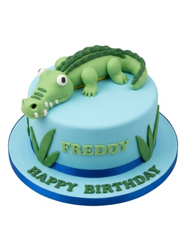 Round light blue birthday cake with a 3D green fondant crocodile and green leaves, with a custom message.