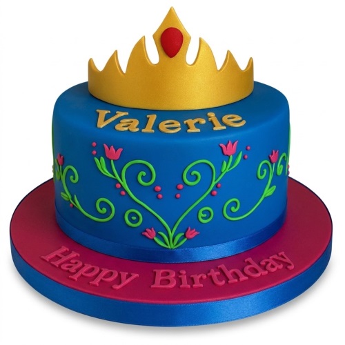 Round blue cake with gold crown, floral vines, and a personalised message board.