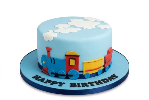 Round light blue fondant cake with a colourful 3D train and carriages, white clouds on top, and "Happy Birthday" written on the board.