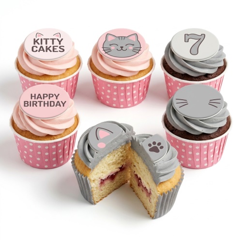 Kitty themed cupcakes with pink and grey frosting, some with cat face, ears, paw print, and custom age topper.