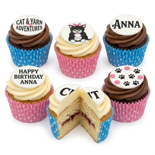 Assortment of cat theme cupcakes with chocolate and vanilla frosting, featuring cat, paw print, and yarn toppers, some with personalised messages.