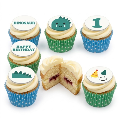 Dinosaur themed birthday cupcakes with white frosting, green and blue wrappers, and custom age toppers.