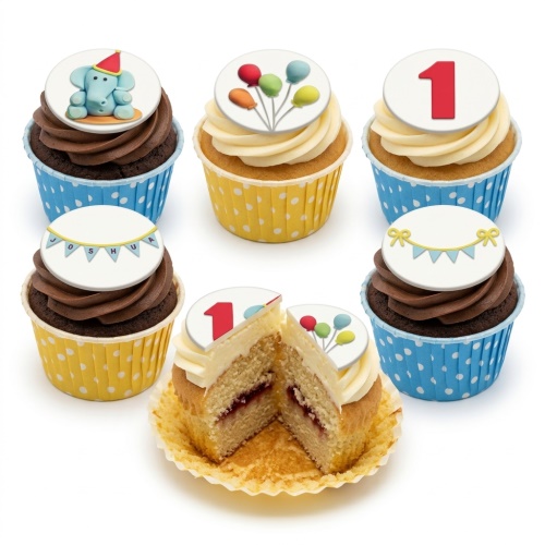 Baby boy celebration cupcakes with blue elephant, balloons, and bunting toppers on blue and yellow polka dot wrappers.