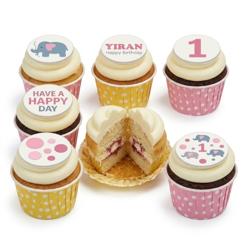 Adorable elephant and polka dot birthday cupcakes with custom age and name toppers.