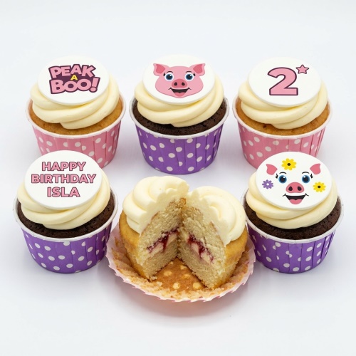 Set of Peppa Pig theme cupcakes with pig faces, 'Peek a Boo!', 'Happy Birthday Isla', and a custom age '2' topper.