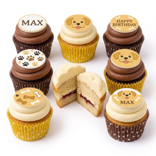 Assortment of dog-themed cupcakes with puppy faces, paw prints, and bone toppers, some with custom text.