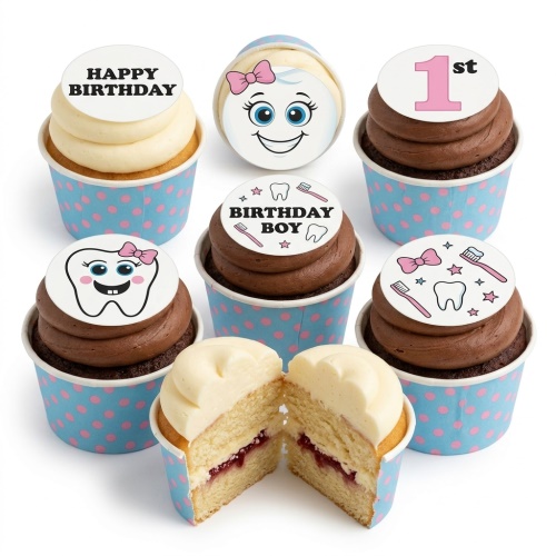 Kids birthday cupcakes with smiling tooth, toothbrush, and star toppers, in blue polka dot wrappers.