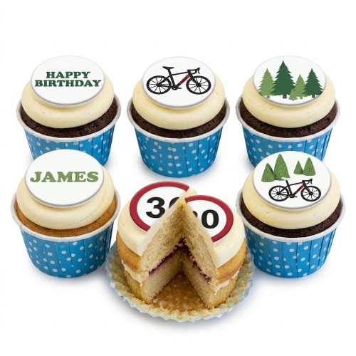 A selection of cupcakes with cycling, tree, 'Happy Birthday', 'James', and '30' speed limit sign toppers.