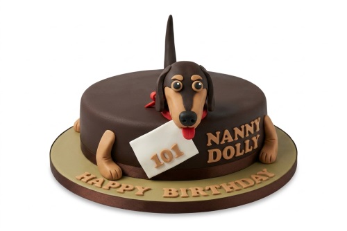 Round brown cake with a 3D fondant dachshund dog, holding a custom age plaque and personalised name.