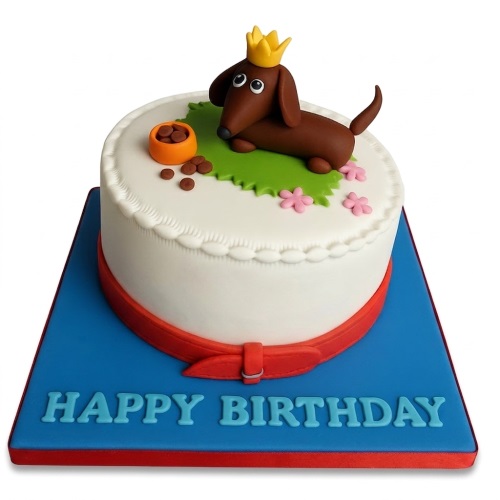 White round birthday cake with a brown fondant Dachshund dog wearing a crown and a 'Happy Birthday' message.