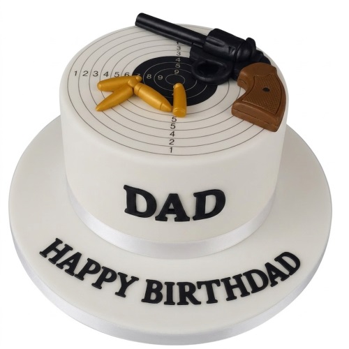 White single-tier cake with a shooting target design, edible gun, bullets, and a custom message.