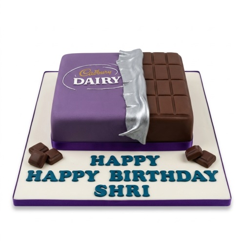 Cadbury chocolate bar birthday cake with purple and silver foil design on a white board.
