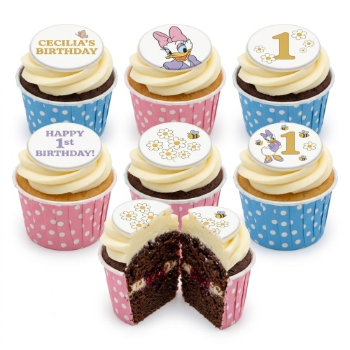 Daisy Duck 1st birthday cupcakes with white frosting, daisy and bee toppers, and polka dot cases.