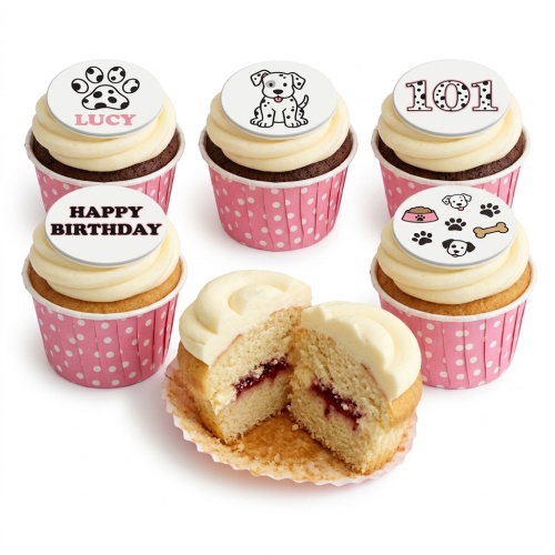 Cupcakes with white frosting and pink polka dot cases, topped with edible discs featuring Dalmatian puppies, paw prints, a bone, a dog bowl, and the number 101.