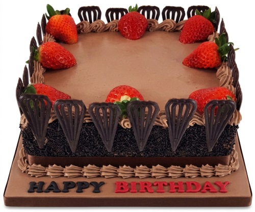 Square chocolate birthday cake with fresh strawberries and chocolate decorations.