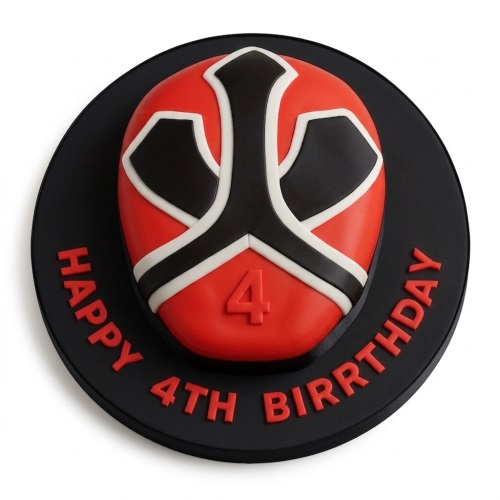 Red, black, and white Power Ranger mask shaped birthday cake on a black board with a custom age and message.