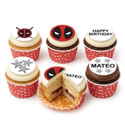 Deadpool and ninja star cupcakes with red polka dot wrappers. One cupcake cut open to show jam.