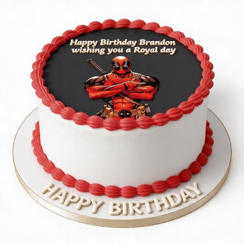 Round white and black Deadpool birthday cake with red piping and a custom message.