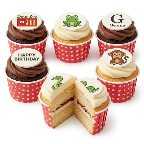 Selection of animal themed cupcakes with frog, monkey, and snake toppers in red polka dot wrappers.